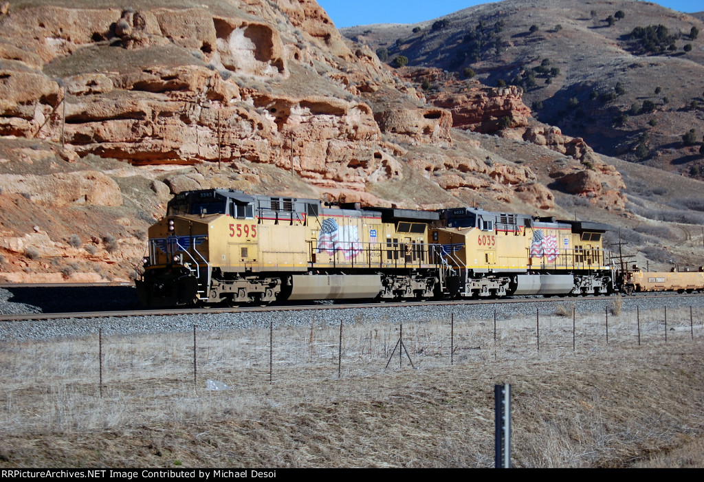 UP AC4400CWCTE #5595 leads a westbound baretable at the I-80/84 westbound on ramp in Echo, UT. March10, 2015